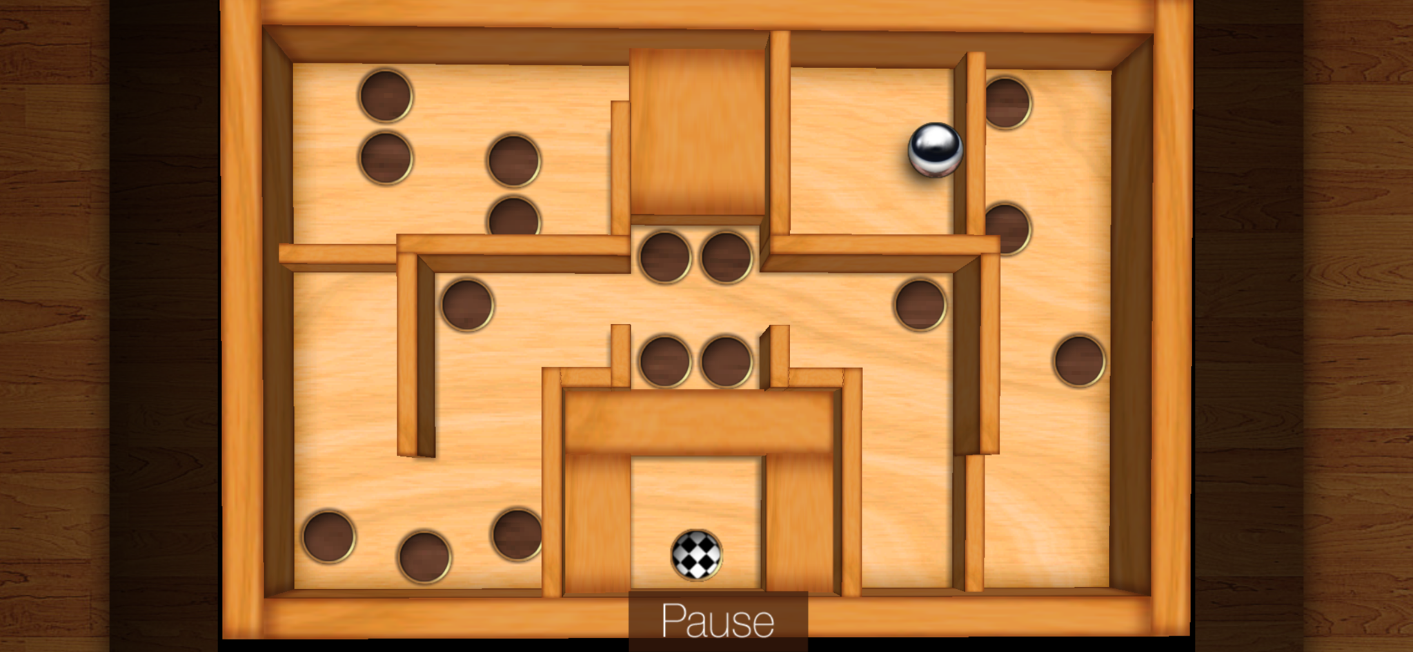 Gameplay screenshot of a wooden labyrinth level